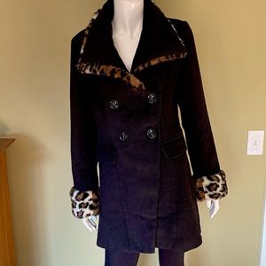Double breasted black pea coat with faux fur trim around neck and cuffs.